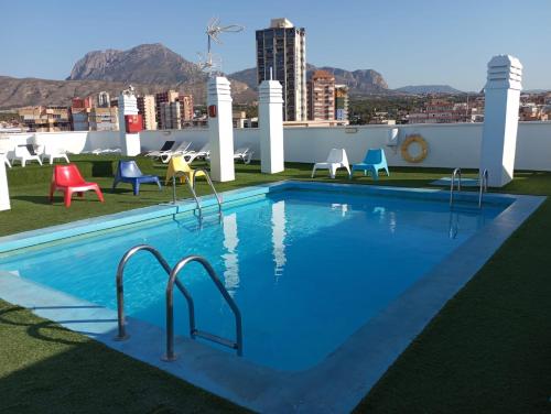 a swimming pool on the roof of a building at FLEMING PLAYA PONIENTE in Benidorm