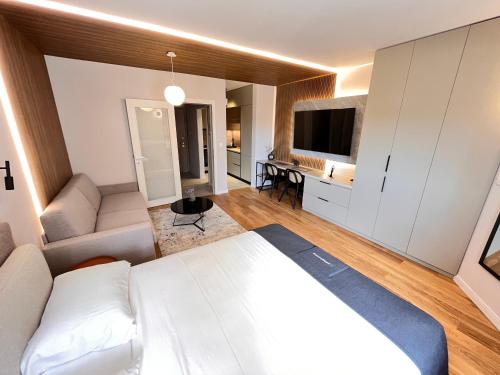 Una televisión o centro de entretenimiento en APART 28- Luxury suites