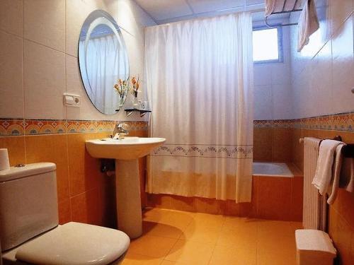 a bathroom with a sink and a toilet and a shower at Cityexpress Hotel Fernando III - Najera in Nájera