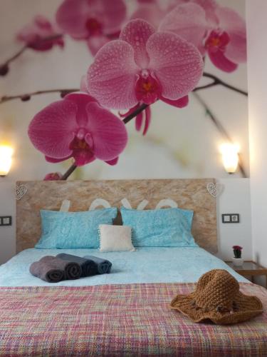 En eller flere senge i et værelse på SUITE JINETES