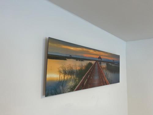 a painting hanging on a wall on a wall at Ferienwohnung Ella in Marktoberdorf