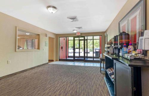 a large room with a kitchen with a counter and a unintention at Extended Stay America Select Suites - Atlanta - Kennesaw Chastain Rd in Kennesaw