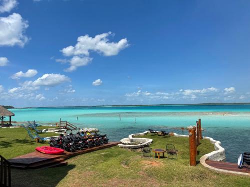 a group of bikes parked on a dock in the water at Blue Caribe Bacalar Front Lagoon in Bacalar