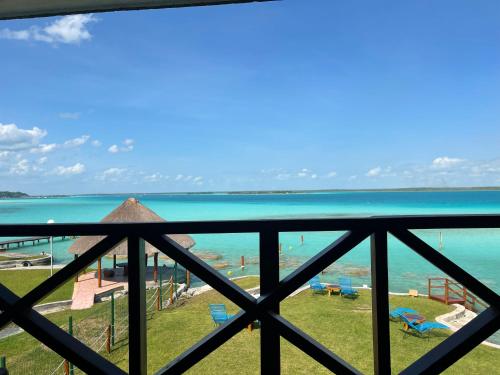 a view of the ocean from the balcony of a resort at Blue Caribe Bacalar Front Lagoon in Bacalar