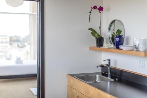 a kitchen with a sink and a window at Abpopa Hillcrest in San Diego