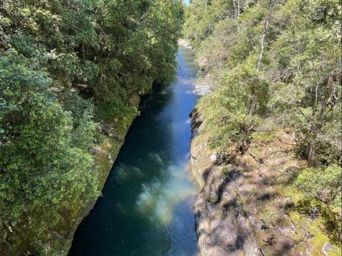 an aerial view of a river in a forest at The Cabin Barrington Tops Your Eco Place in Nature in Chichester