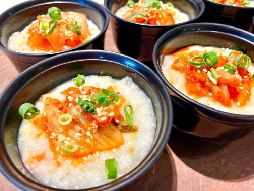 a group of bowls of food on a table at Hotel Monterey Okinawa Spa & Resort in Onna