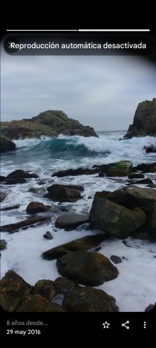a picture of the ocean with rocks and water at Septiembre se pasa mejor en los Molles, te esperamos en cabaña5 in Los Molles