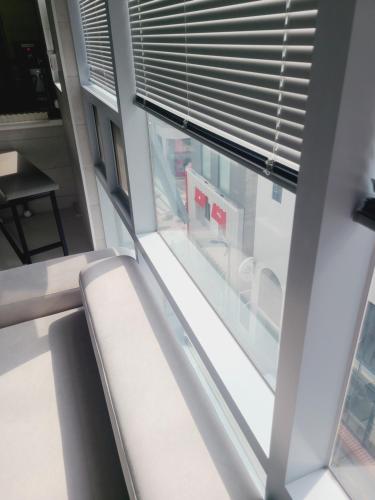 a room with a window with blinds at Elephant in Busan