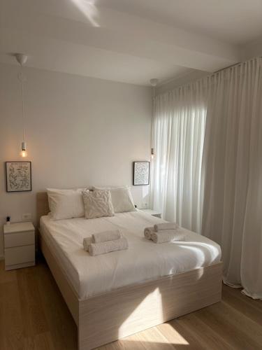 Ένα ή περισσότερα κρεβάτια σε δωμάτιο στο TINEL studio apartment