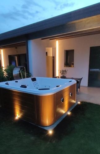 a hot tub in the yard of a house at I SECOLARI in Sannicandro di Bari