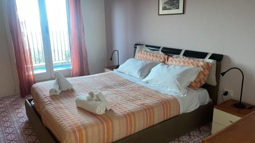 Tempat tidur dalam kamar di Marevietri
