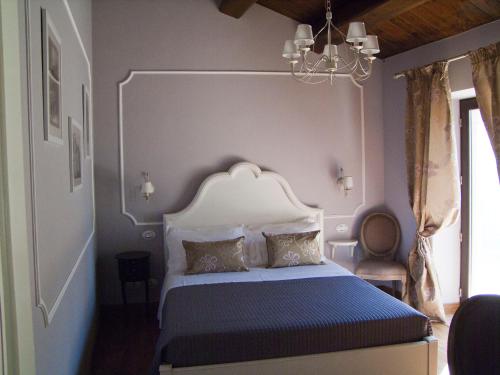 Postel nebo postele na pokoji v ubytování B&B San Nicolò