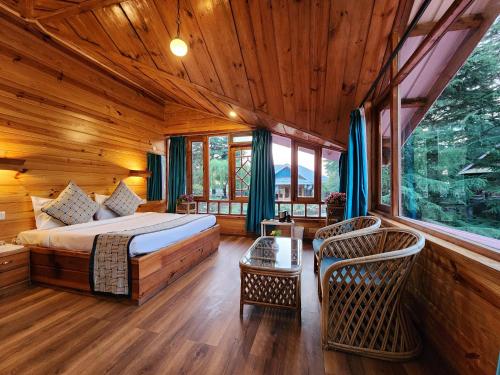 Voodi või voodid majutusasutuse The Chalets Naldehra toas