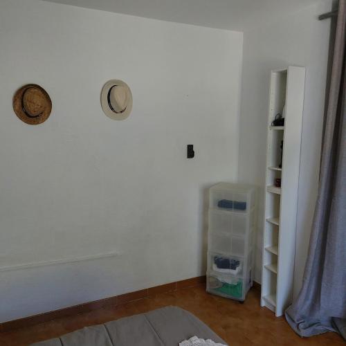 a room with a white wall and a shelf at Naturetmer4 in Six-Fours-les-Plages