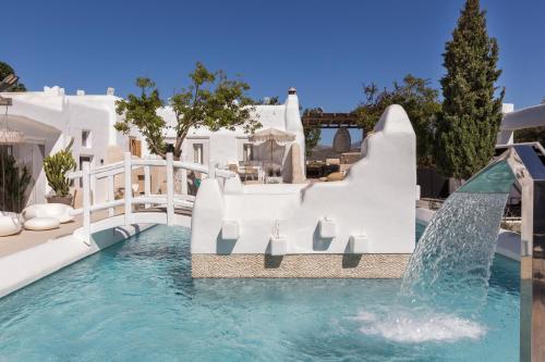 a water slide in a pool at a resort at Kallos Villas & Suites in Naxos Chora
