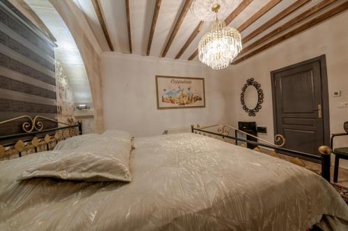 Postel nebo postele na pokoji v ubytování Cappadocia Vera Inn