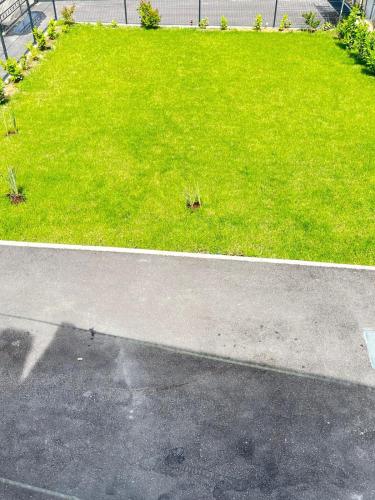 a grassy area with a fire hydrant on a street at Villa Erwin with heated pool in Imotski