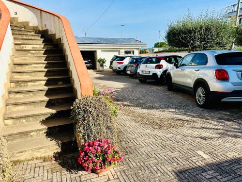 a bunch of cars parked in a parking lot at InVilla Bed&Breakfast - Quality Rooms in Santa Maria di Castellabate