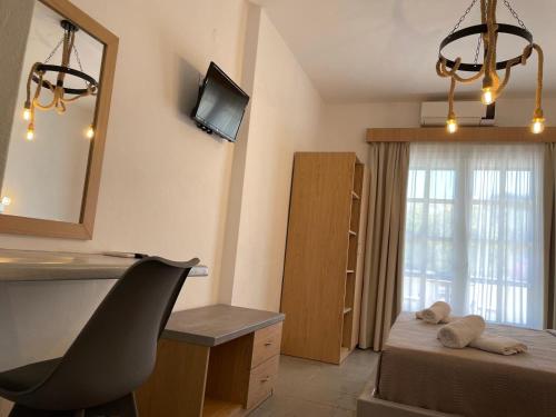 TV a/nebo společenská místnost v ubytování Astri Hotel