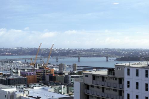 a view of a city with a bridge in the background at Sky Stars Essential Reserve in Auckland