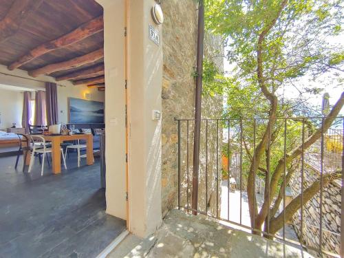 a view from the living room of a house with a balcony at SUNRISE'S Lodge in Pianello Del Lario