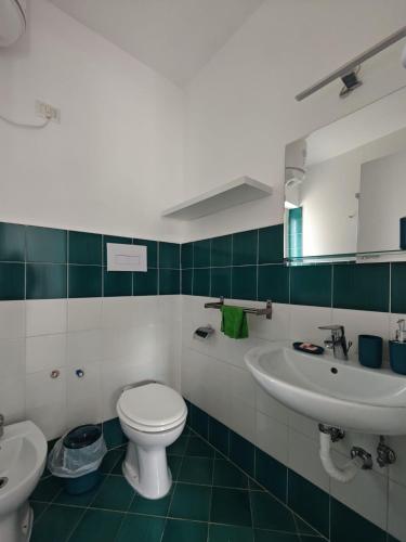 a bathroom with a toilet and a sink at Casa Ferraro in Marina Grande di Capri