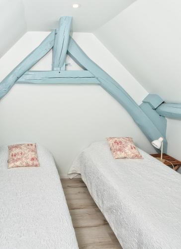 Katil atau katil-katil dalam bilik di Gîte de charme, grand confort