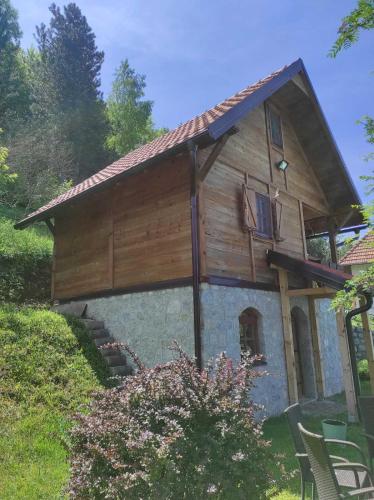 a small house with a wooden roof on top at Vila VRABAC in Priboj