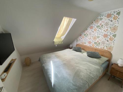 Katil atau katil-katil dalam bilik di Ferienwohnung 2 Klangweberei im Frankenwald