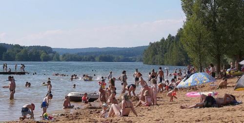 a group of people on a beach in the water at Ferienwohnung Bickel - Am großen Brombachsee in Spalt