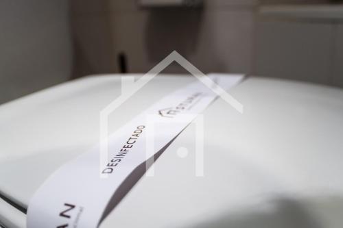 a close up of a clock on a table at El gayo - Apartamento en Luanco in Luanco