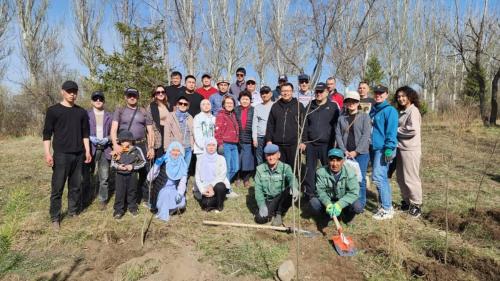 a group of people posing for a picture in a field at Tagaytay Karakol Hotel in Karakol