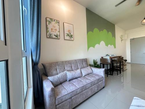 a living room with a couch and a table at 马六甲 Melaka Amber cove residence Jonker Street in Melaka