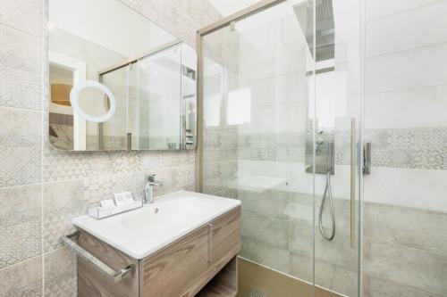 a bathroom with a sink and a shower at Hotel Maggiore in Bologna