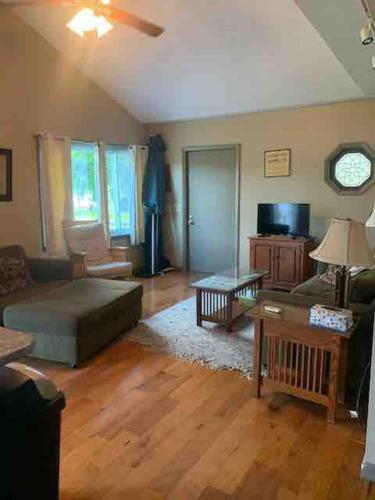 a living room with a couch and a table at Serenity on Lamoka in Hammondsport