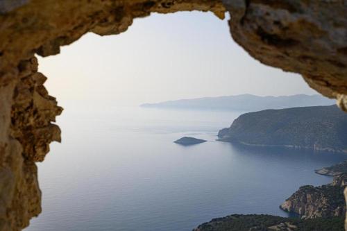 a view of the ocean from a window at Arsithea Villa in Monólithos