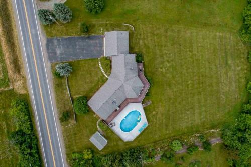 an overhead view of a house with a pool in a field at Keuka Glory in Hammondsport