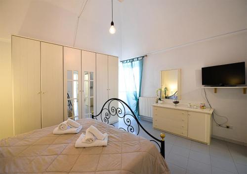 Ένα ή περισσότερα κρεβάτια σε δωμάτιο στο Casa Silvana