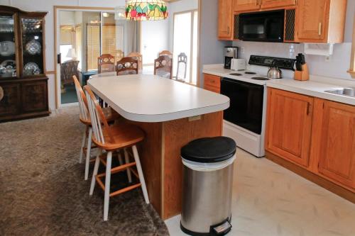 a kitchen with a island in the middle of it at Weller Island Bliss in Hammondsport