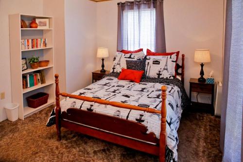a bedroom with a bed and a book shelf at Weller Island Bliss in Hammondsport