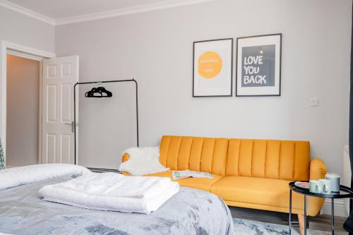 a living room with a couch and a bed at Host & Stay - Bridge Street Apartments in Evesham
