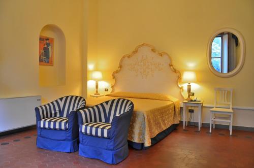 Tempat tidur dalam kamar di Residence Michelangiolo