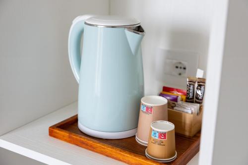 a tea kettle on a shelf in a kitchen at Hotel Maggiore in Bologna