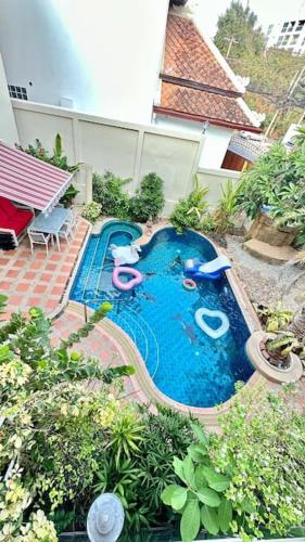 an overhead view of a swimming pool in a backyard at Luxury Garden Pool Villa near Beach & Walking Street in Pattaya South