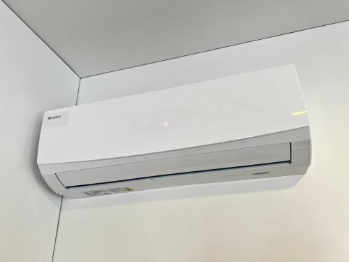 a white video game system on a wall at Gedimino 19 apartments in the old town of Ukmergė in Ukmergė