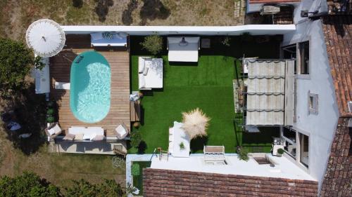 an overhead view of a backyard with a swimming pool at Unique Villa Near Lisbon with Pool & Magical Decor in Cheira Ventos