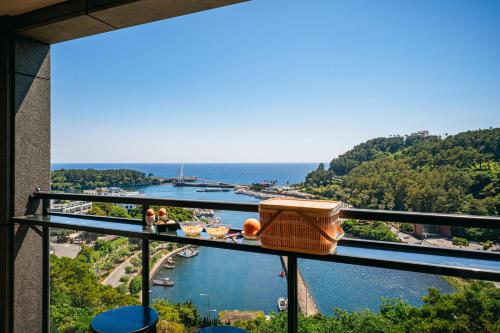 a view of a river from a balcony at Hotel Yeon in Seogwipo