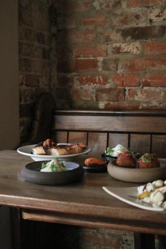 a table with three plates of food on it at The Fleur de Lys in Dorchester on thames