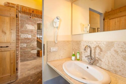 a bathroom with a sink and a shower at Locanda del Vino Nobile, Montepulciano Rooms AC, WI-FI in Sant'Albino